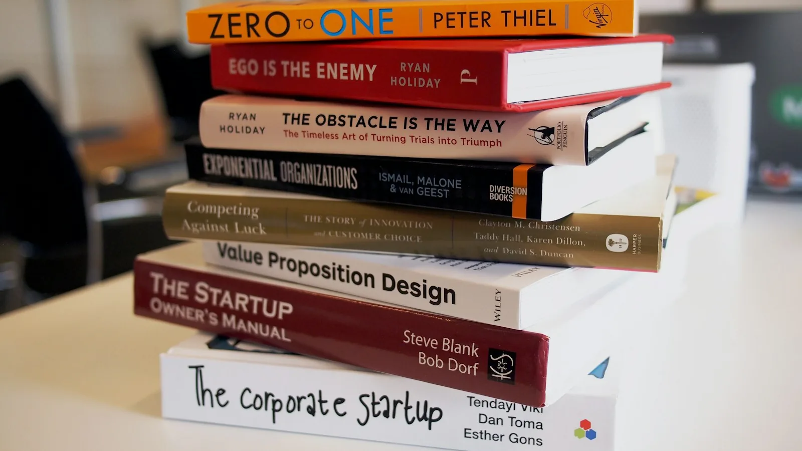 Open hardcover books stacked on a table